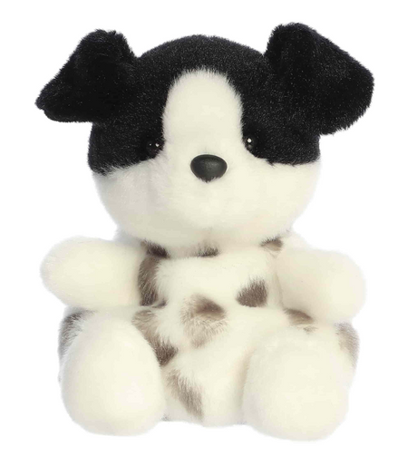 Plush puppy with black floppy ears and white spotted body sitting with an eager and playful expression.