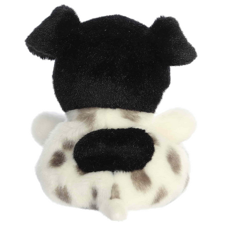 Plush puppy with black floppy ears and white fur with black spots seen from the back showing compact paws and tail
