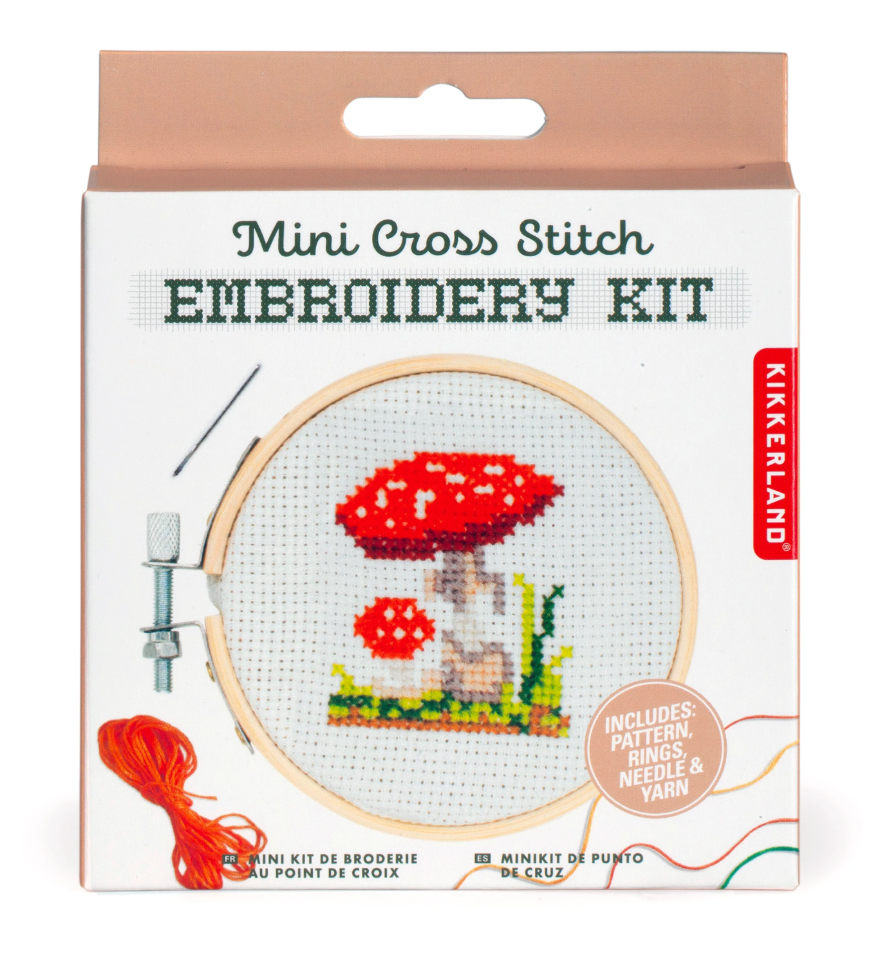 Mini cross stitch embroidery kit with mushroom design, bamboo hoop, needle, yarn, and pattern for a fun craft project