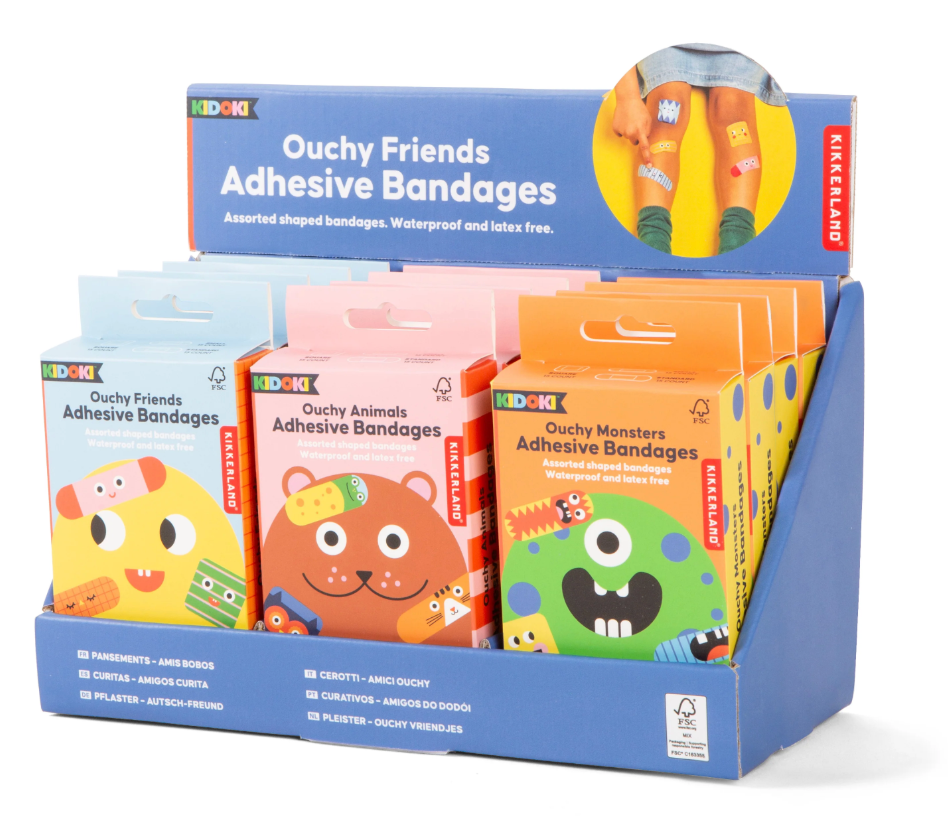 Display of colorful Ouchy Friends Adhesive Bandages featuring playful shapes and designs, waterproof and latex free.