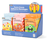 Display of colorful Ouchy Friends Adhesive Bandages featuring playful shapes and designs, waterproof and latex free.