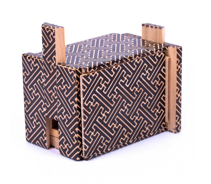 Intricate Japanese puzzle box with a geometric pattern, designed to hide a secret compartment inside.
