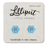 Blue and white snowflake earrings with titanium posts displayed on a handmade Lilliput Little Things card