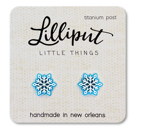 Blue and white snowflake earrings with titanium posts displayed on a handmade Lilliput Little Things card