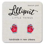 Red Christmas mitten earrings with snowflake design on card labeled handmade titanium post for sensitive ears