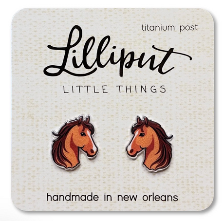 Cute horse head stud earrings with titanium posts on a branded card, designed for sensitive ears and everyday wear