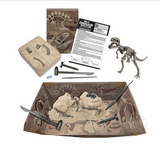 T-Rex Dig Kit with tools, excavation block, instruction sheet, and assembled Tyrannosaurus Rex skeleton model kit