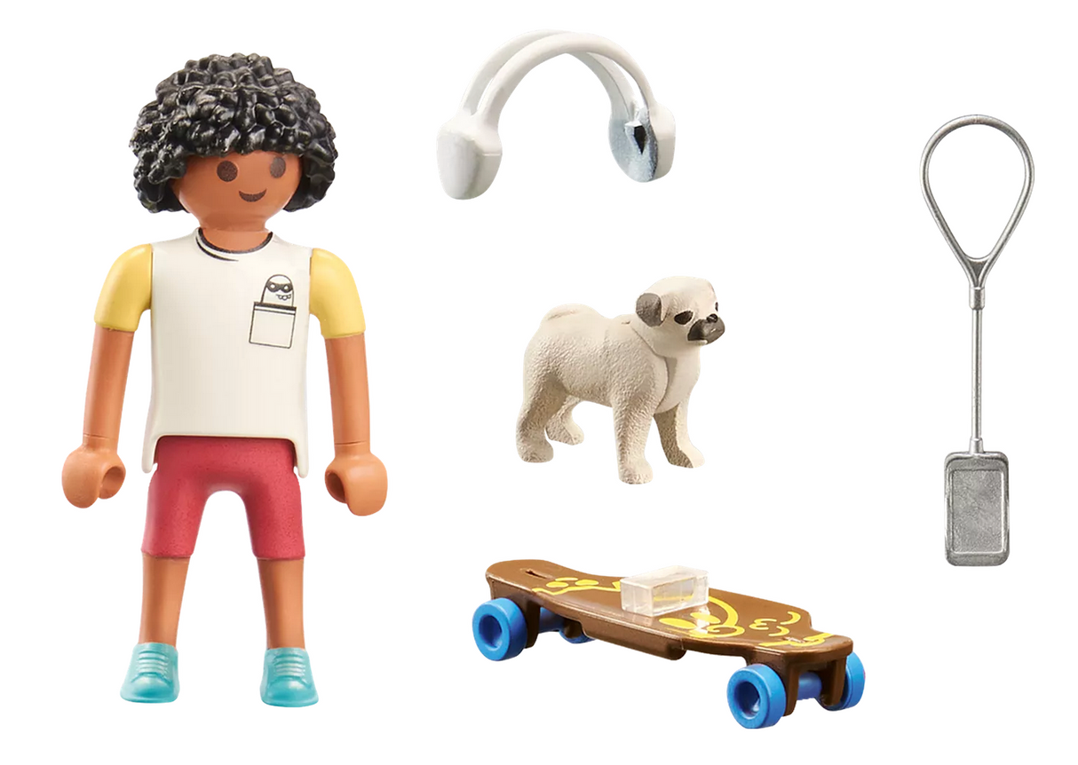 Play figure with curly hair in red shorts and yellow shirt, small beige dog, skateboard, headphones, and fish tank net toy