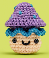 The Woobles Crochet Kit | Irving the Mushroom crocheted mushroom with purple cap and smiling face