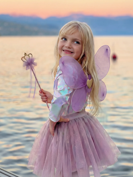 Royal Fairy Princess Skirt Set | Purple worn by a child with fairy wings beside the water