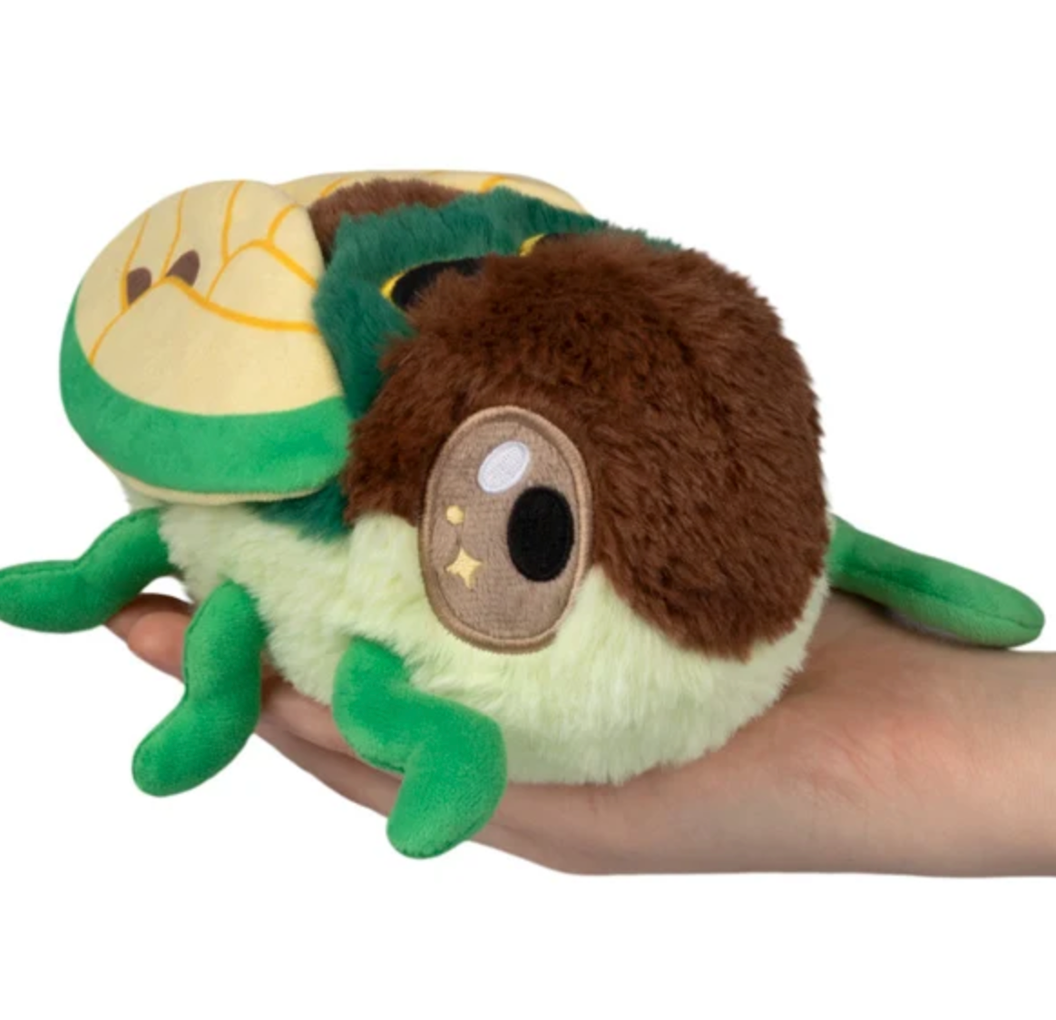 Cicada Snackers plush cicada toy held in a hand