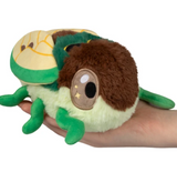 Cicada Snackers plush cicada toy held in a hand