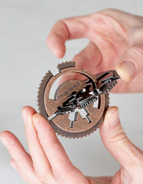 True Genius | Roman Water Clock held in hands showing intricate gears and mechanical details