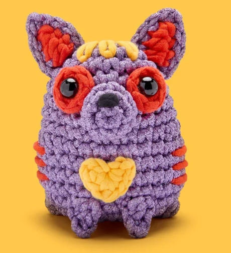 The Woobles Crochet Kit | Pablo the Alebrije Dog purple crocheted dog with red ears and yellow heart