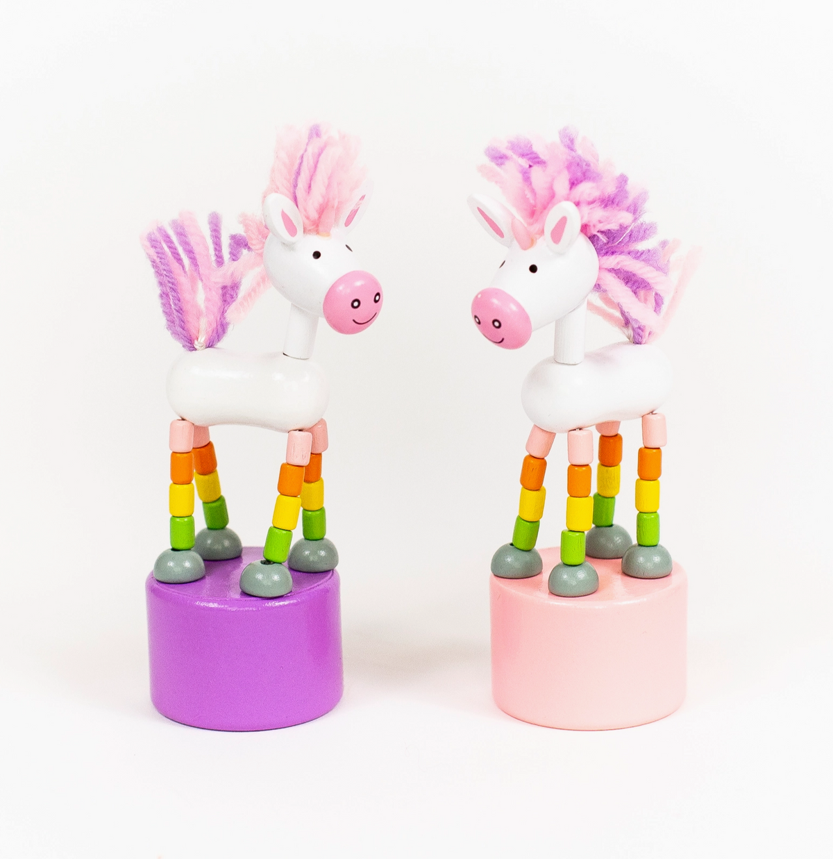 ThumbToy Unicorn colorful wooden unicorn toys on pink and purple bases