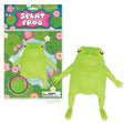 Green squishy frog toy with warty back and outstretched limbs next to colorful packaging with lily pads and flowers