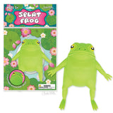 Green squishy frog toy with warty back and outstretched limbs next to colorful packaging with lily pads and flowers