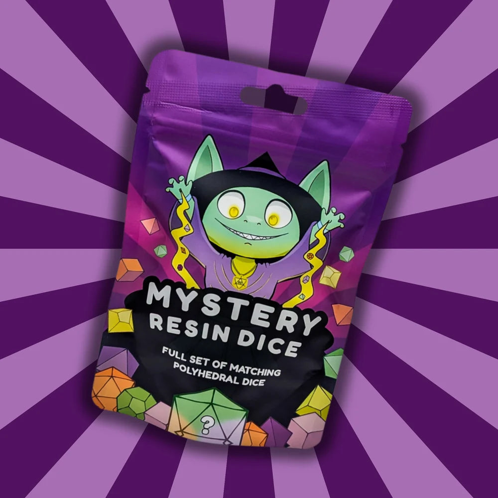 Purple package with a smiling green cat character and the words Mystery Resin Dice against a purple starburst background