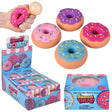 Colorful squishy donut toys with sprinkles displayed beside colorful retail boxes and a hand holding one donut