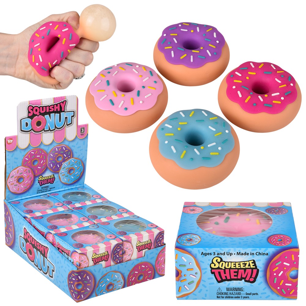 Colorful squishy donut toys with sprinkles displayed beside colorful retail boxes and a hand holding one donut