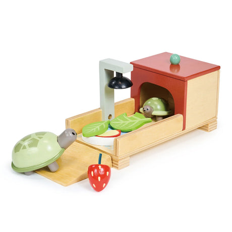 Tortoise Pet Set wooden play set with parent and baby tortoise, cozy home, heater lamp, leaves, apple slice, and strawberry.