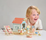 Sandy's Beach Hut wooden toy with seagulls, fish and chips stall, deck chair, boat, and seaside accessories for imaginative play.