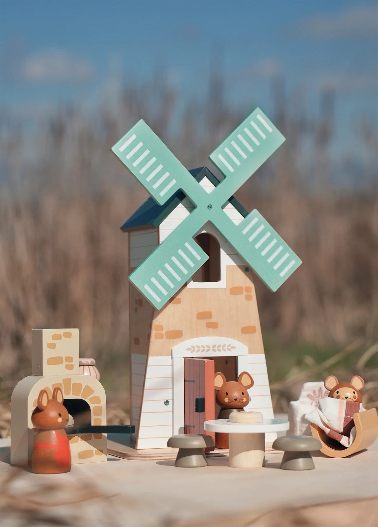 Penny Windmill wooden toy with mice, bread oven, table, stools, and revolving windmill for imaginative play.