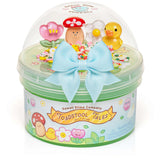 Toadstool Tales Jelly Slime in a clear tub with colorful charms and a blue bow on top.