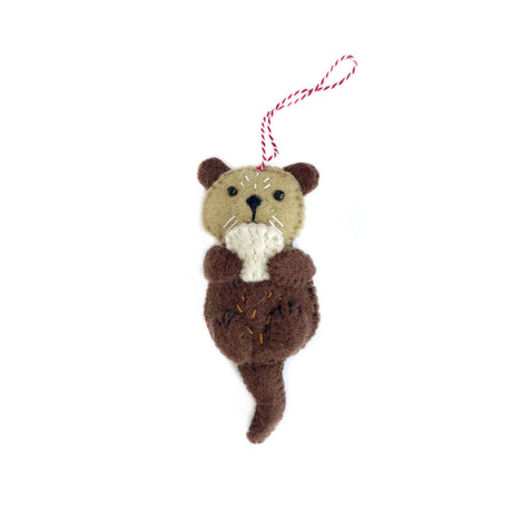 Handmade felt otter ornament in brown and tan wool with stitched details and red striped hanging loop
