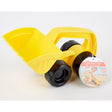 Small yellow toy digger with black wheels and handle designed for sand or outdoor play