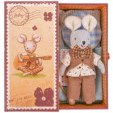Soft fabric mouse toy dressed in linen vest, checkered bow tie, and patterned shirt inside decorated stamp box