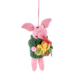 Handfelted pink pig ornament wearing a green cardigan holding colorful felted presents hanging by a pink string