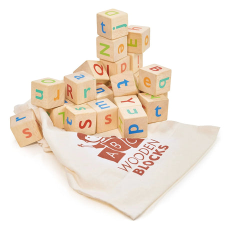 Stack of colorful wooden alphabet blocks spilling out of a cream drawstring bag labeled wooden blocks for children’s learning play