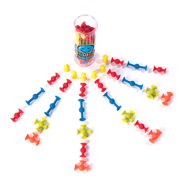 Squigz Mini colorful suction construction pieces arranged around a clear storage cup