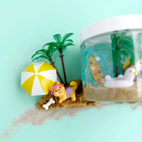 KidDough To Go | Puppy Beach Party with sensory dough, puppy figurines, beach umbrella, palm trees, and sand play elements.