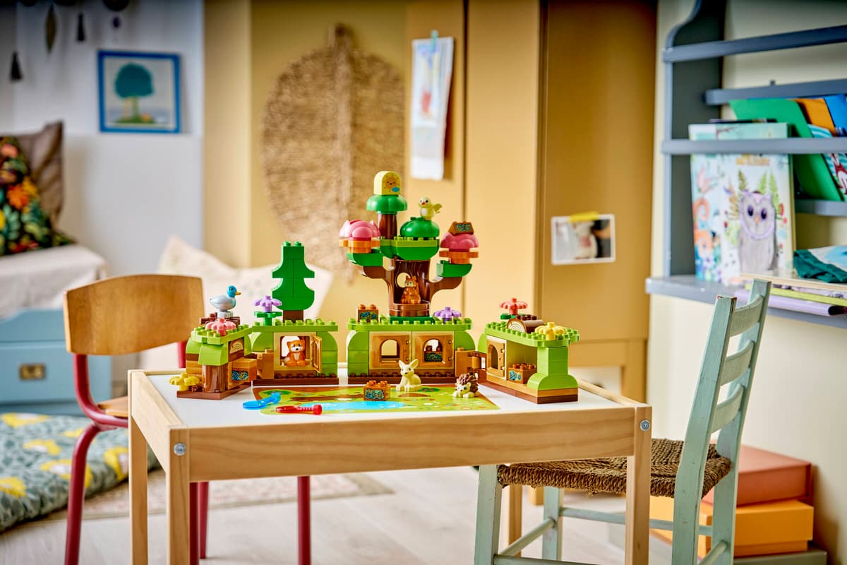 Duplo Discovery Forest with Wild Animals set displayed on a children's table with colorful forest bricks and figures