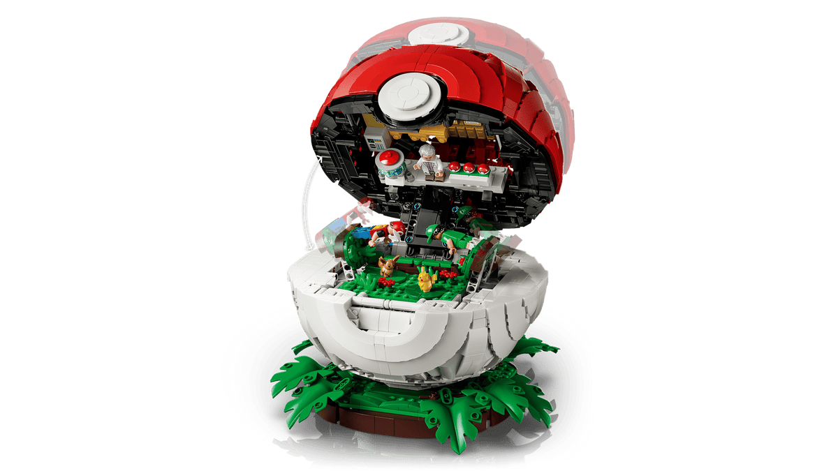 Pokemon Iconic Trainer Moments Poke Ball opened to reveal a detailed Pokemon scene with greenery and figures