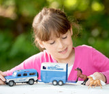 Girl playing with a blue die-cast Land Rover and Breyer Farms two-horse trailer with loading ramp and toy horses