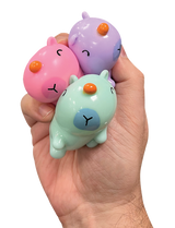 Sticky Bubble Blobbies | Capybara featuring three pastel capybara squishy figures held in a hand