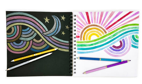 Double Metallic Colored Pencil Set showing vibrant metallic drawings on black and white sketchpads with colored pencils.