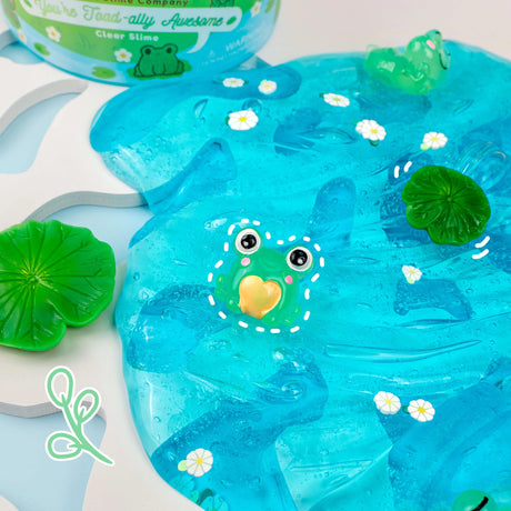 You're Toad-ally Awesome Clear Slime with bright blue color, water lily scent, and cute toad charms for playful fun.