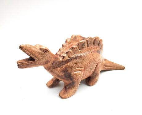 Wooden Dino-Sound Stegosaurus hand carved wooden dinosaur that creates sound when blown into the hole on its back.