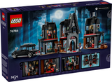 LEGO building kit of a dark gothic cottage with minifigures and a black car under a full moon night sky