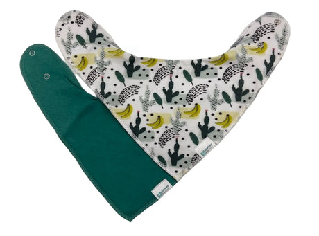 Dribble Bib | Cactus Banana featuring soft, absorbent fabric with cactus and banana print and adjustable snap closures.