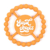 Teether | Sweet Cheeks silicone teether in orange with easy grip and soothing design for babies' sore gums.