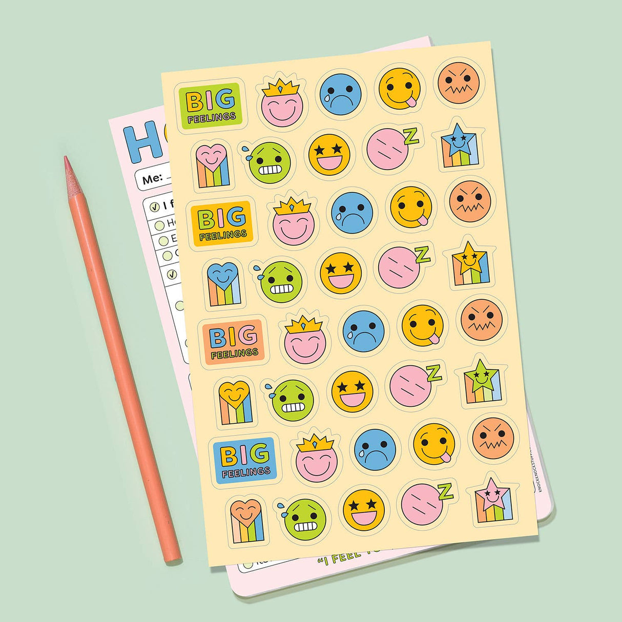 Sheet of colorful stickers featuring various happy, sad, sleepy, and silly facial expressions for kids to explore emotions.