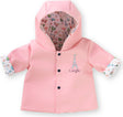Light pink hooded jacket with black snaps and Paris-themed patterned lining featuring Eiffel Tower and bicycles