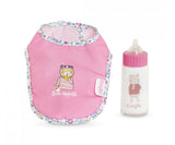 Pink baby bib with floral trim and bear design next to matching baby bottle with bear illustration and pink cap
