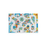 Crossroads City Play Mat featuring colorful streets, buildings, vehicles, and playful urban scenes for kids aged 2 and up.