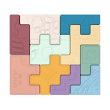 Set of interlocking pastel-colored puzzle pieces with various embossed shapes and textures on white background
